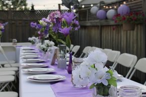Table setup with plates and purple toned linens