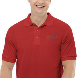 A man wearing a red polo shirt and smiling.